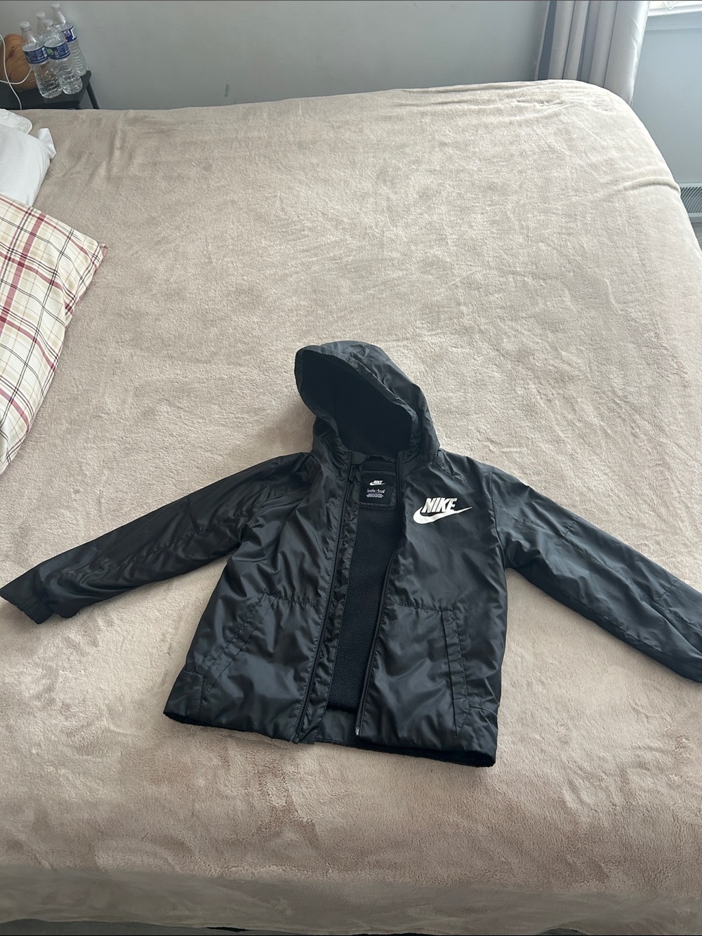 Nike Kids Black Hooded Rain Jacket with White Logo